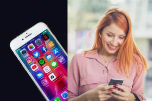 A young lady is standing using a cell phone and smiling.  Creative Christian Social Media marketing offers cost-effective marketing