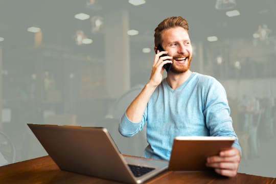 Client on phone thrilled with his marketing results
