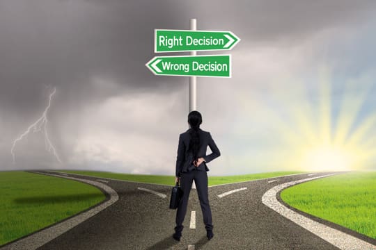 Businessperson at "Y" in road, deciding on taking the right decision or wrong. Church Marketing Firms can help you decide