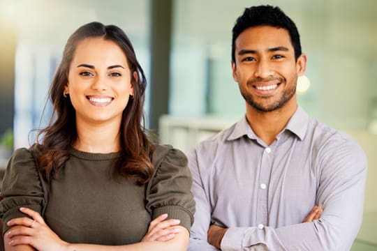 Portrait of two young Christian Branding professionals at work in a modern office