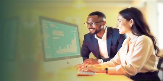 Young man and woman excited about the results their seeing. Christian Web Designer