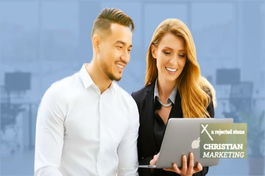 Two young professionals pleased with their marketing results