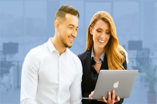 Two young professionals pleased with their marketing results