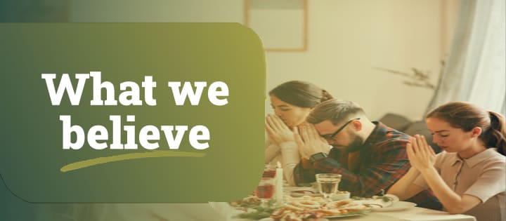 What we believe. Family praying before a big dinner. ars - Christian Branding Agency