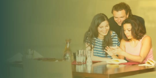 Family at restaurant sharing a Social Media Post